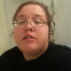 A fat girl with glasses video records herself taking a shit while sitting on a toilet in two scenes. Sounds of her grunting and shit falling into the water are clearly heard. Her poop is seen in the toilet in the second scene. An interesting clip!